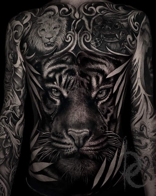 Black and grey tiger and lion back piece realism tattoo by Devin Clausen